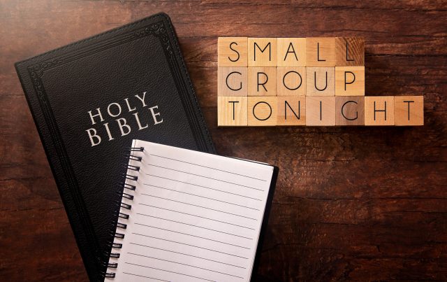 Small Group Tonight in Block Letters on a Wooden Table with a Bible